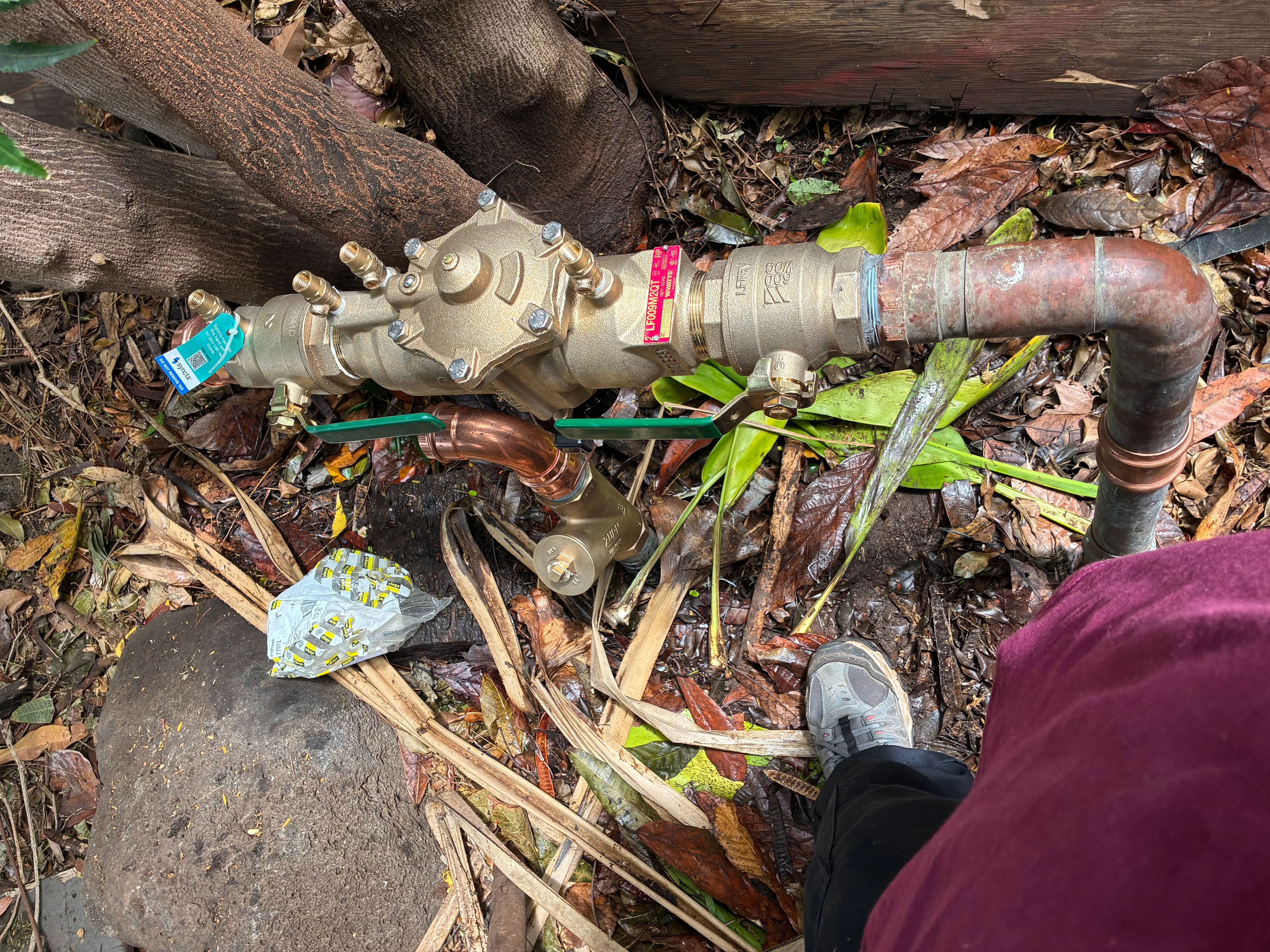 New brass ball valves and copper piping installed for water main shut-off assembly